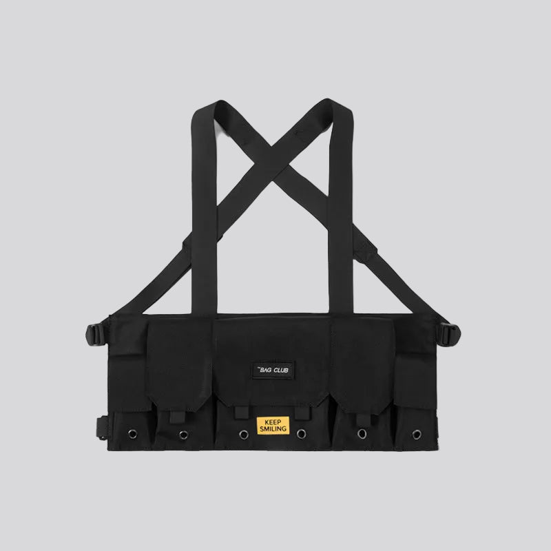 Black tactical vest with suspenders on a white background